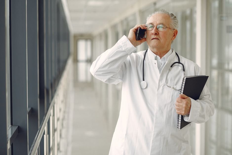 A doctor ready to discuss colon cancer screening options with a male patient