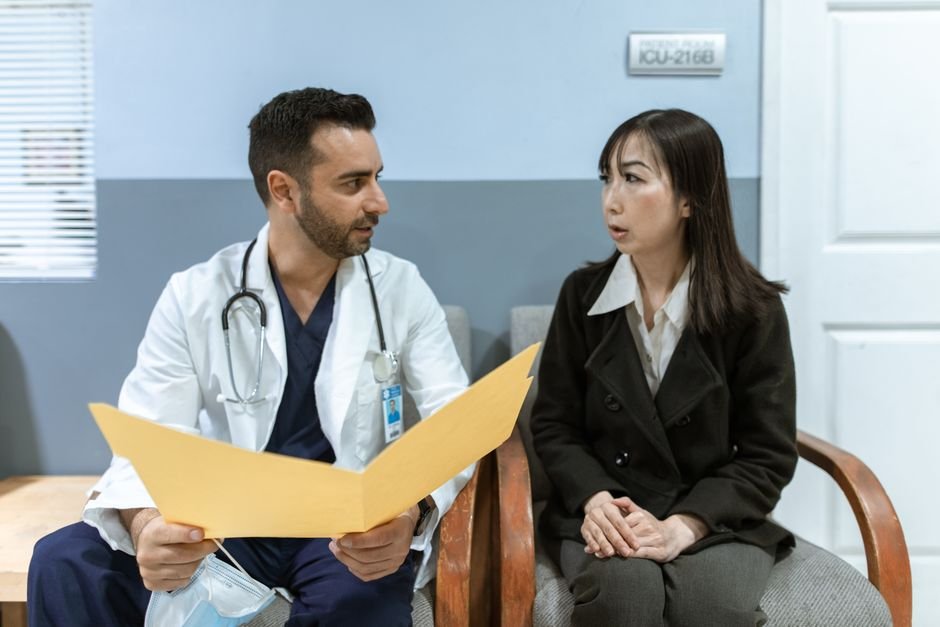 A healthcare professional explaining a prostate blood test result to a male patient